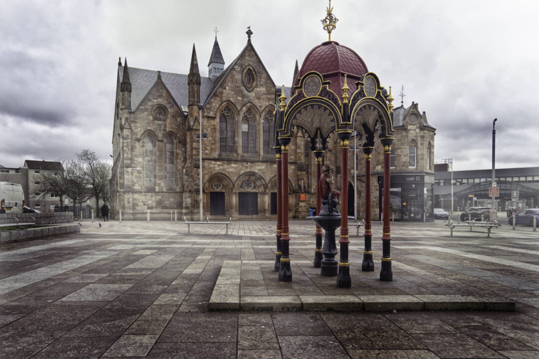 A photograph of the gazebo in Govan Cross Square, in front of the Govan and Linthouse Parish Church.